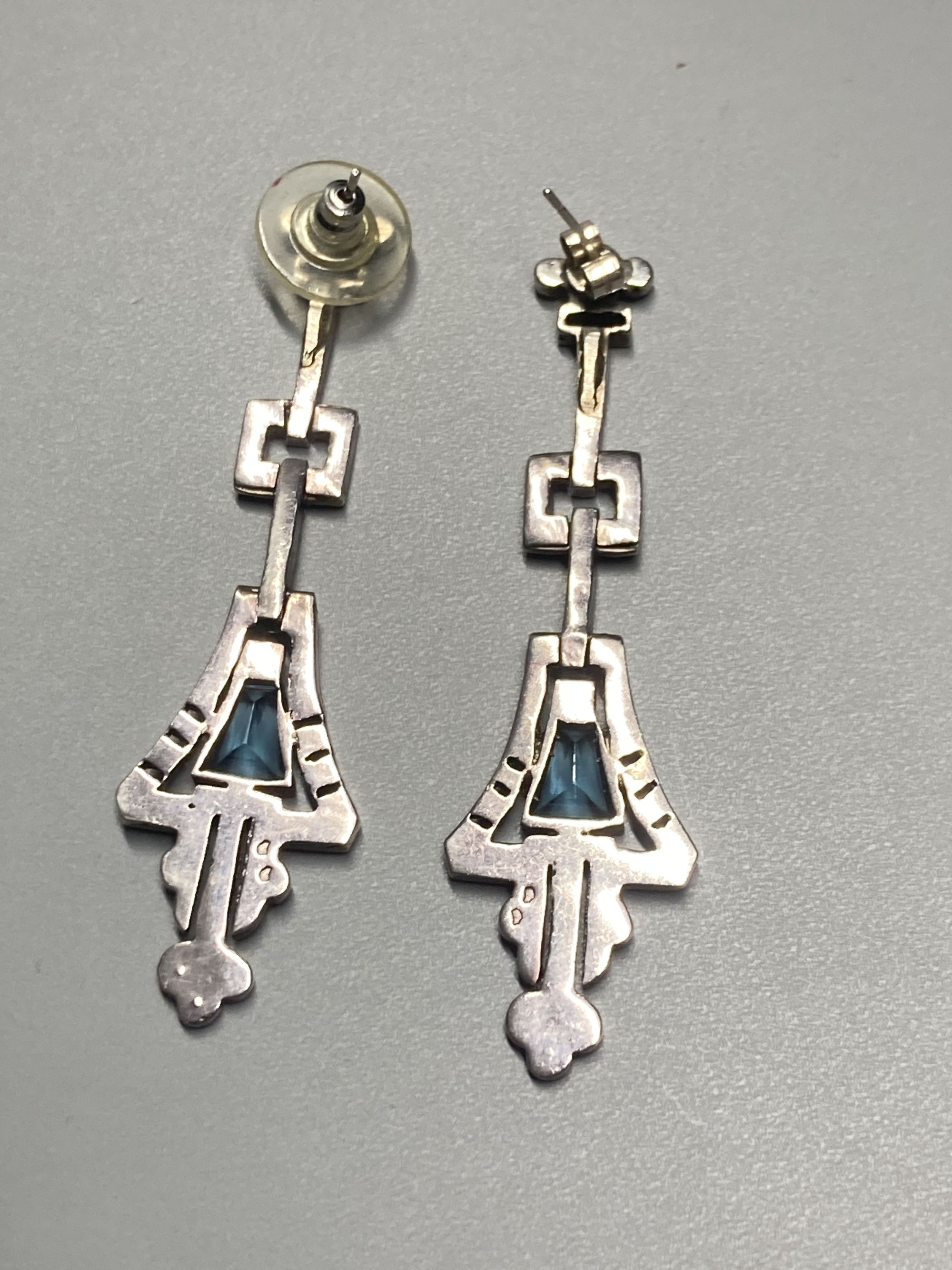 A pair of 1920s/1930s French white metal, white and blue paste set drop earrings, 61mm.